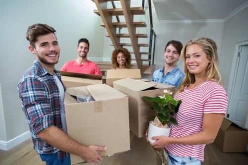 Removal team preparing a move in Blackwall near modern apartments