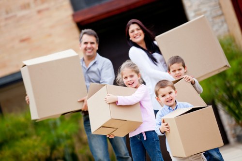 Trained Blackwall moving staff handling furniture