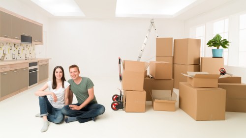 Local moving team handling boxes and furniture near Blackwall