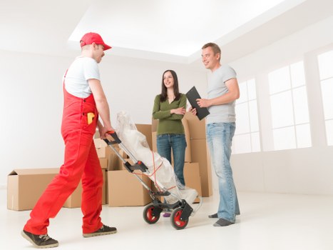 Packed boxes and moving equipment ready for a local Blackwall relocation