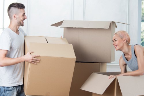 Local furniture collection service loading a sofa and chairs in Blackwall