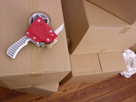 Blackwall moving van helping with furniture transport near residential flats