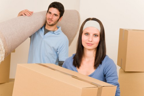Moving team carrying items during a scheduled removal job