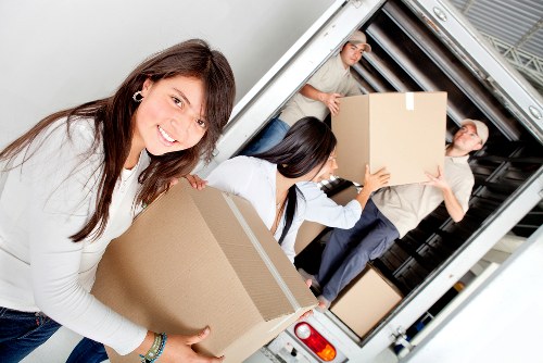 Packed office boxes and furniture ready for transport in Blackwall