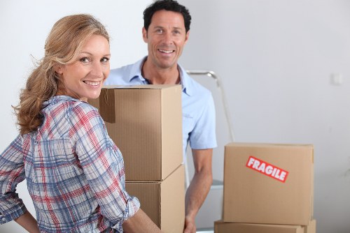 Packed moving boxes and furniture ready for house removals in Blackwall